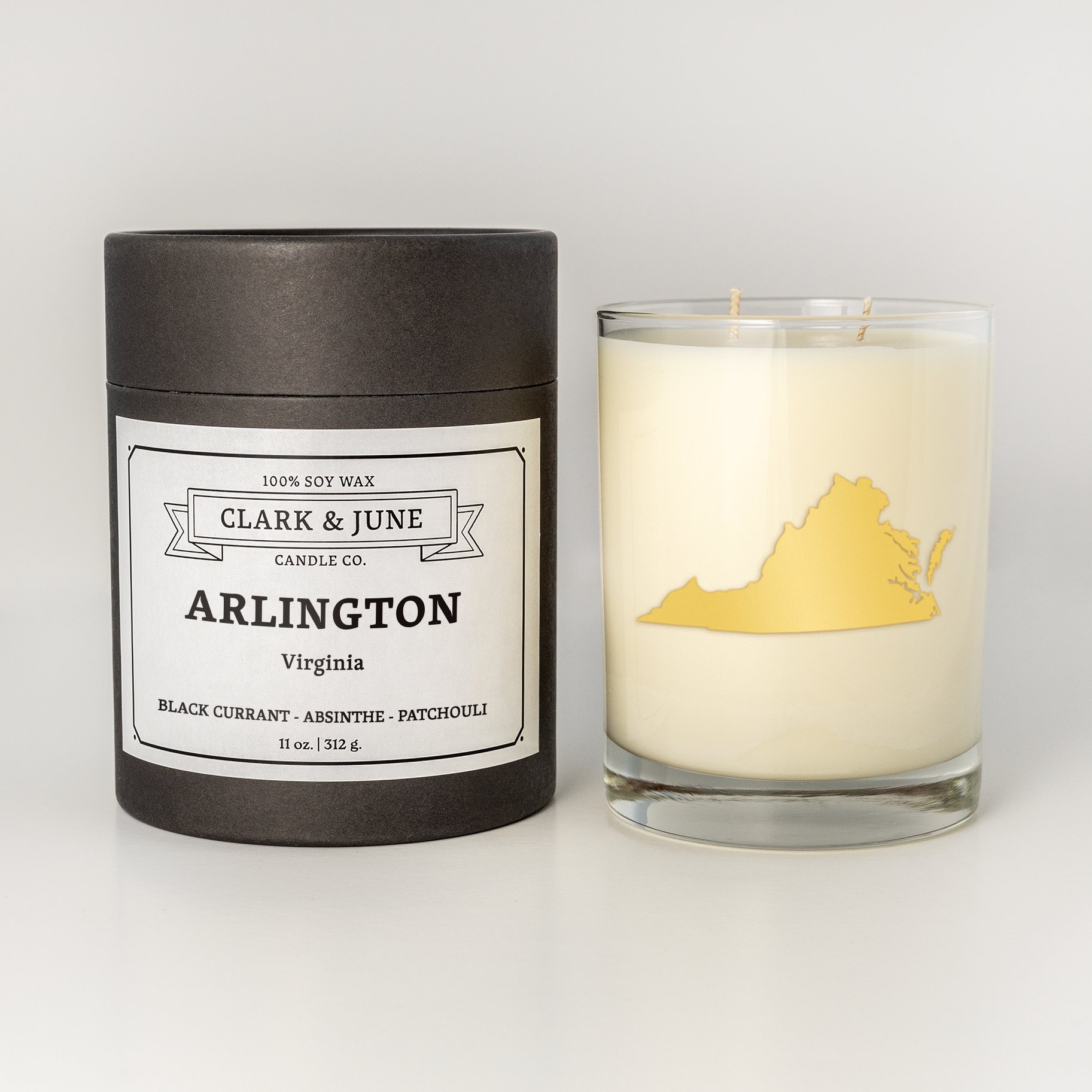 Double wicked soy candle in a 13.5 oz tumbler with the state of  Virginia  printed in 22k gold foil on the face. Black cylinder packaging with Arlington  on the label. SEO Text – Drinking glass, soy wax candle, Christmas Candle, hand poured, small batch, scented candle, Woman Owned, local candle, Housewarming present, gives back, charity, community candle, becomes a cocktail glass, closing gift.