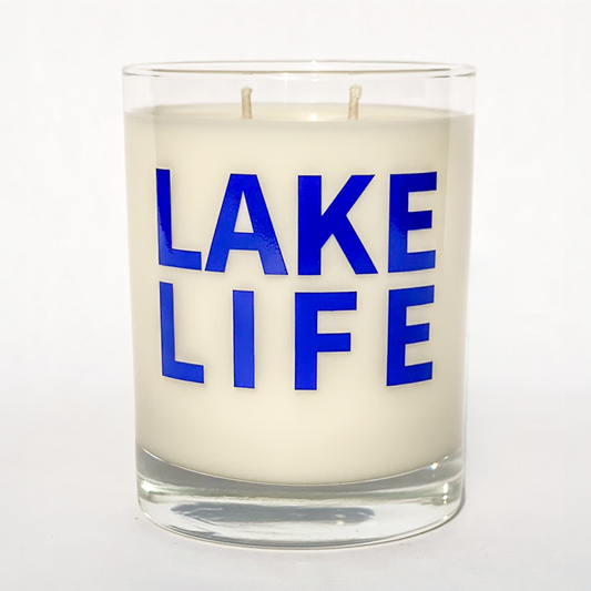 Double wicked soy candle in a 13.5 oz tumbler with "Lake Life" printed on the face.. SEO Text – Drinking glass, soy wax candle, Christmas Candle, hand poured, small batch, scented candle, Woman Owned, local candle, Housewarming present, gives back, charity, community candle, becomes a cocktail glass, closing gift.