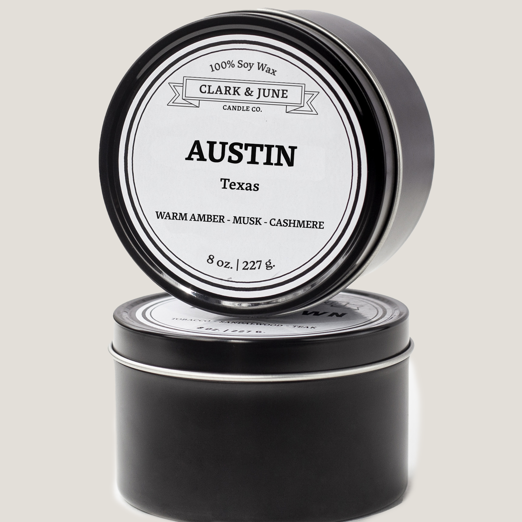 Double wicked soy candle in a 13.5 oz tumbler with the state of Texas printed in 22k gold foil on the face. Black cylinder packaging with “Austin Texas” on the label. SEO Text – Drinking glass, soy wax candle, Alabama candle, hand poured, small batch, scented candle, Woman Owned, local candle, Housewarming present, gives back, charity, community candle, becomes a cocktail glass, closing gift.