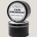 Load image into Gallery viewer, Single wicked 8oz candle in a black finish with Cape Girardeau on the label. SEO Text –soy wax candle, Missouri candle, hand poured, small batch, scented candle, Woman Owned, local candle, Housewarming present, gives back, charity, community candle, closing gift.