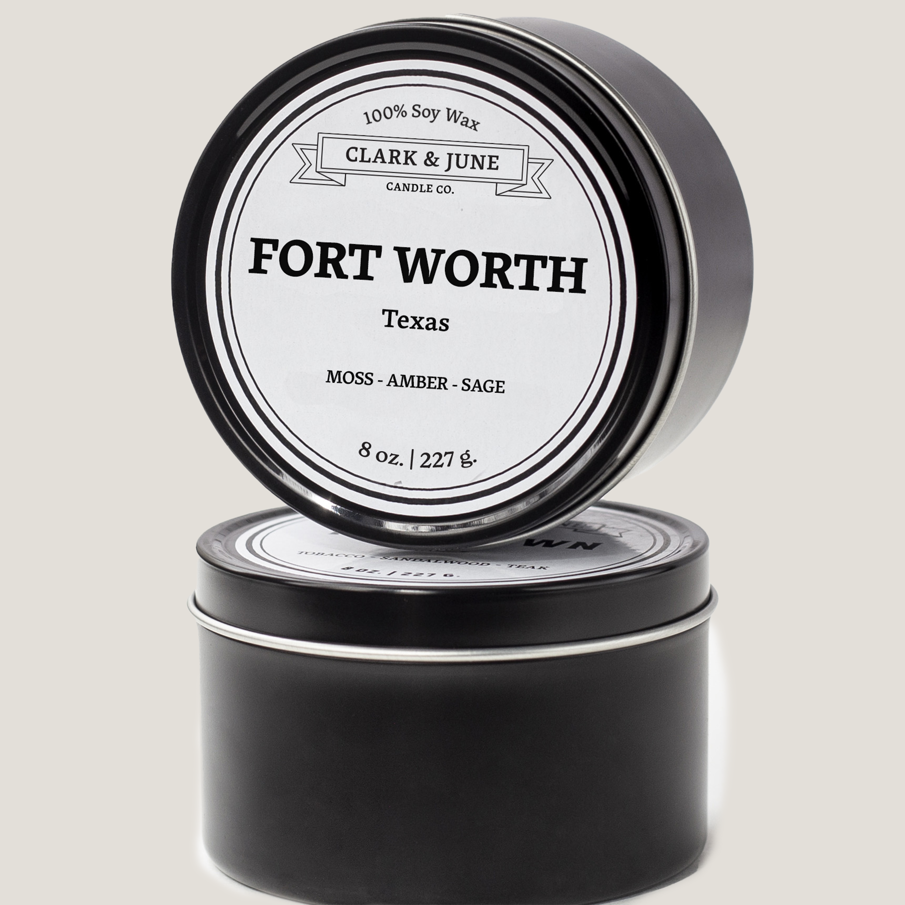 Single wicked 8oz candle in a black finish with Fort Worth  on the label. SEO Text –soy wax candle, Texas candle, hand poured, small batch, scented candle, Woman Owned, local candle, Housewarming present, gives back, charity, community candle, closing gift.