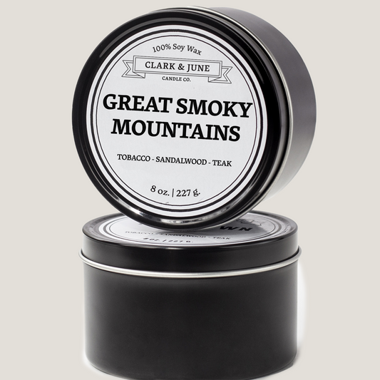 Single wicked 8oz candle in a black finish with Great Smoky Mountains  on the label. SEO Text –soy wax candle, North Carolina candle, hand poured, small batch, scented candle, Woman Owned, local candle, Housewarming present, gives back, charity, community candle, closing gift.