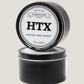 Load image into Gallery viewer, Single wicked 8oz candle in a black finish with HTX on the label. SEO Text –soy wax candle, Texas candle, hand poured, small batch, scented candle, Woman Owned, local candle, Housewarming present, gives back, charity, community candle, closing gift.