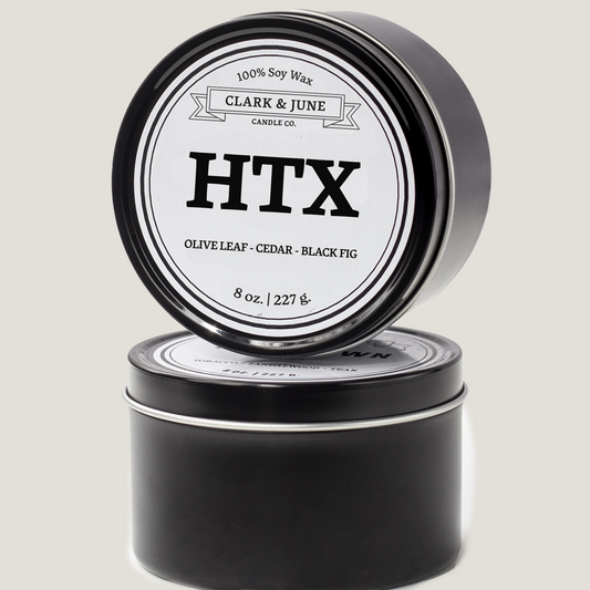 Single wicked 8oz candle in a black finish with HTX on the label. SEO Text –soy wax candle, Texas candle, hand poured, small batch, scented candle, Woman Owned, local candle, Housewarming present, gives back, charity, community candle, closing gift.