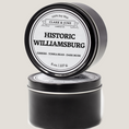 Load image into Gallery viewer, Single wicked 8oz candle in a black finish with Historic Williamsburg on the label. SEO Text –soy wax candle, Virginia candle, hand poured, small batch, scented candle, Woman Owned, local candle, Housewarming present, gives back, charity, community candle, closing gift.