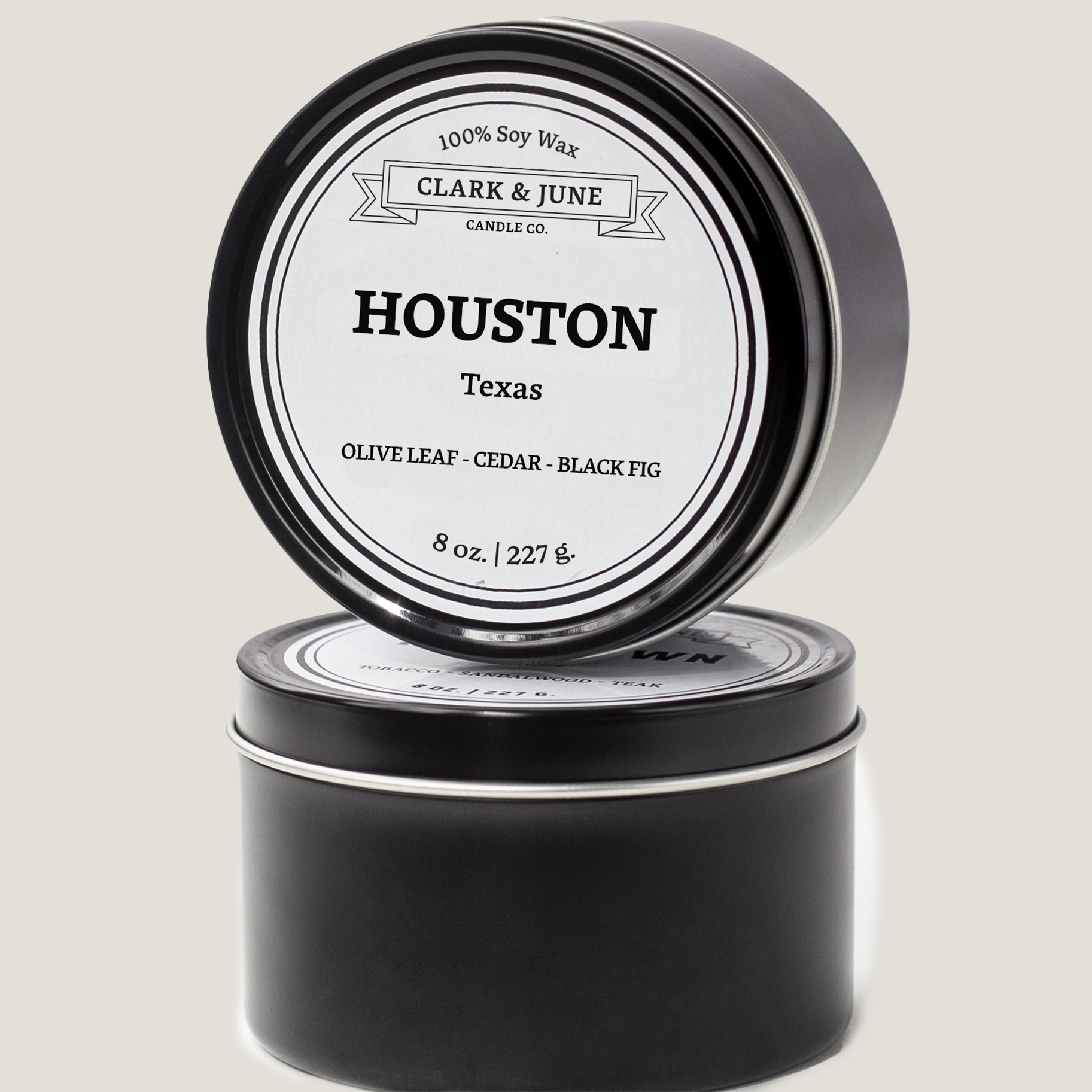 Single wicked 8oz candle in a black finish with Houston  on the label. SEO Text –soy wax candle, Texas candle, hand poured, small batch, scented candle, Woman Owned, local candle, Housewarming present, gives back, charity, community candle, closing gift.