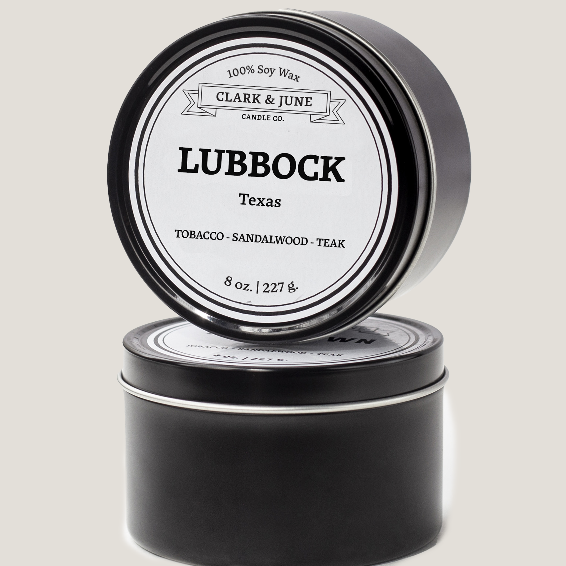 Single wicked 8oz candle in a black finish with Lubbock  on the label. SEO Text –soy wax candle, Texas candle, hand poured, small batch, scented candle, Woman Owned, local candle, Housewarming present, gives back, charity, community candle, closing gift.