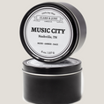 Load image into Gallery viewer, Single wicked 8oz candle in a black finish with Music City on the label. SEO Text –soy wax candle, Tennessee candle, hand poured, small batch, scented candle, Woman Owned, local candle, Housewarming present, gives back, charity, community candle, closing gift.
