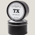 Load image into Gallery viewer, Single wicked 8oz candle in a black finish with TX on the label. SEO Text –soy wax candle, Texas candle, hand poured, small batch, scented candle, Woman Owned, local candle, Housewarming present, gives back, charity, community candle, closing gift.