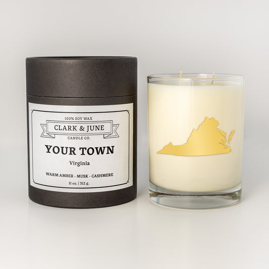 Double wicked soy candle in a 13.5 oz tumbler with the state of Virginia printed in 22k gold foil on the face. Black cylinder packaging with a customizable label. SEO Text – Drinking glass, soy wax candle, Florida candle, hand poured, small batch, scented candle, Woman Owned, local candle, Housewarming present, gives back, charity, community candle, becomes a cocktail glass, closing gift.
