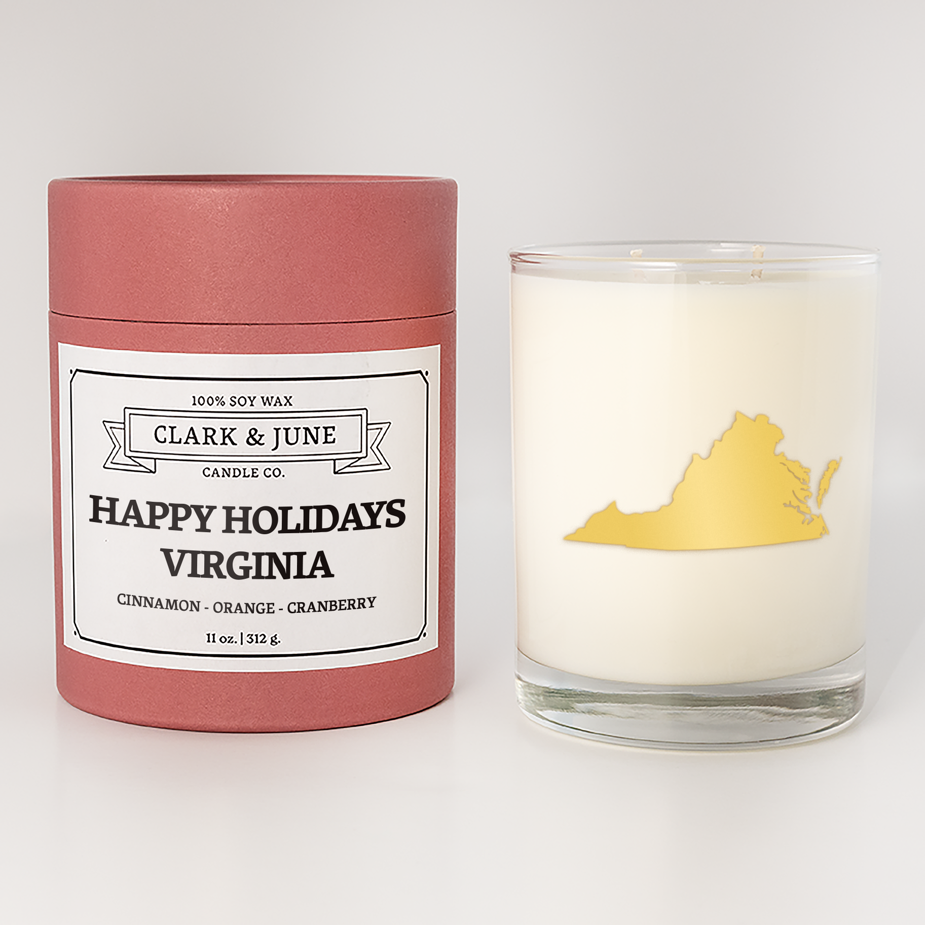 Double wicked soy candle in a 13.5 oz tumbler with the state of  Virginia printed in 22k gold foil on the face. Red cylinder packaging with Happy Holidays Virginia on the label. SEO Text – Drinking glass, soy wax candle, Christmas Candle, hand poured, small batch, scented candle, Woman Owned, local candle, Housewarming present, gives back, charity, community candle, becomes a cocktail glass, closing gift.