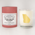 Load image into Gallery viewer, Double wicked soy candle in a 13.5 oz tumbler with the state of Georgia printed in 22k gold foil on the face. Red cylinder packaging with Home for the Holidays on the label. SEO Text – Drinking glass, soy wax candle, Christmas Candle, hand poured, small batch, scented candle, Woman Owned, local candle, Housewarming present, gives back, charity, community candle, becomes a cocktail glass, closing gift.
