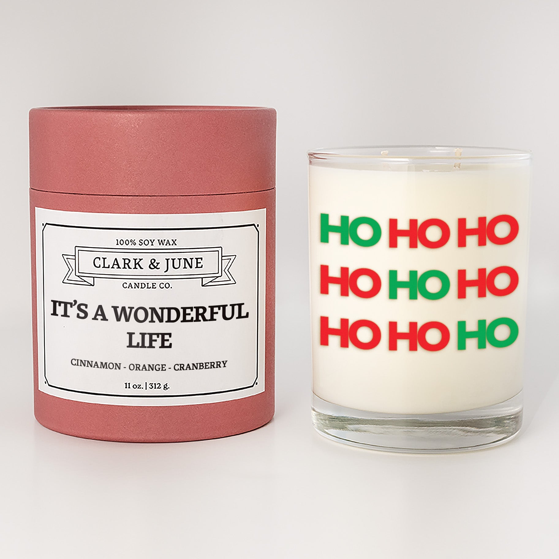 Double wicked soy candle in a 13.5 oz tumbler with HO HO HO printed on the face. Red cylinder packaging withIt's a Wonderful Lifeon the label. SEO Text – Drinking glass, soy wax candle, Christmas Candle, hand poured, small batch, scented candle, Woman Owned, local candle, Housewarming present, gives back, charity, community candle, becomes a cocktail glass, closing gift.