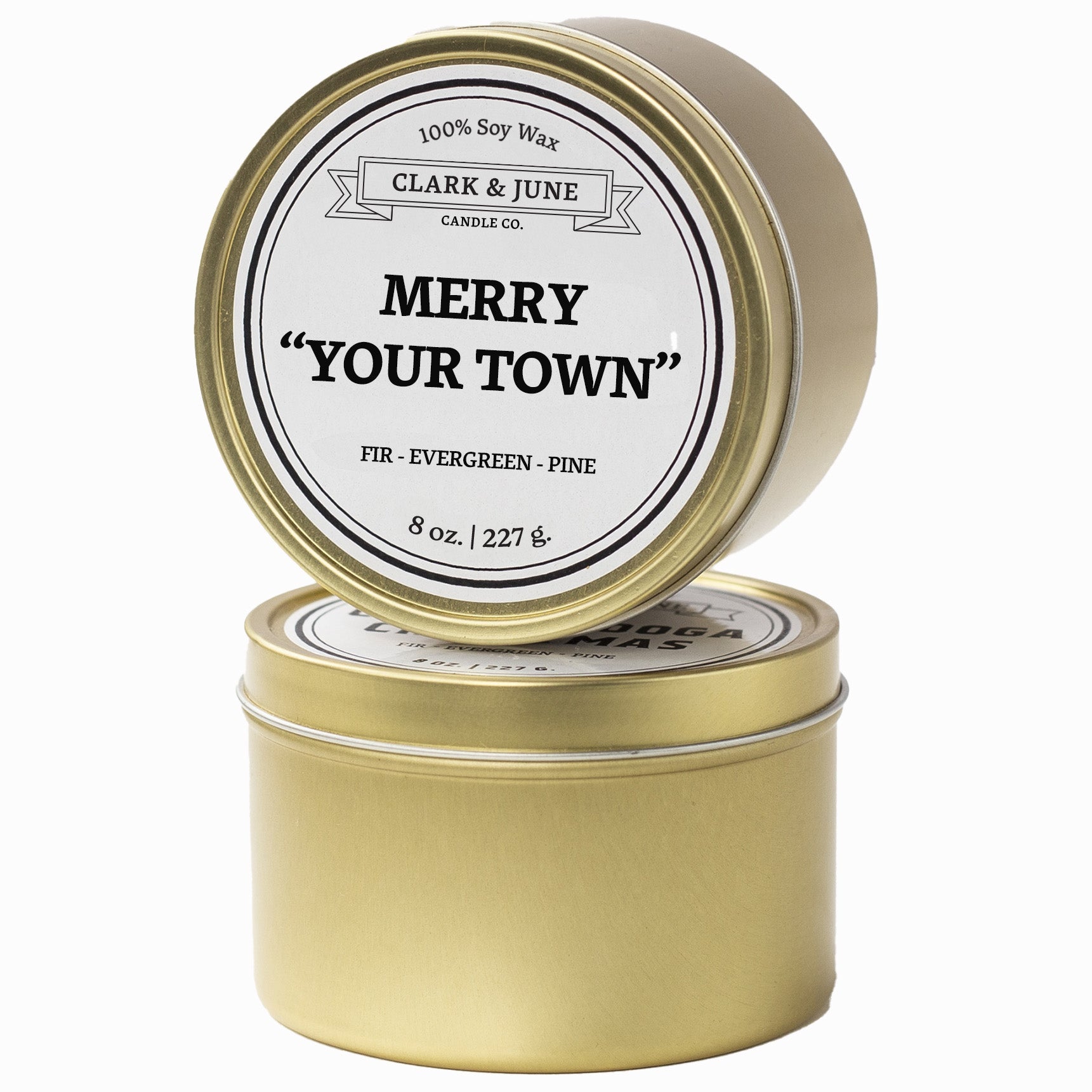 Single wicked Fir - Evergreen - Pine scented 8oz candle in gold finish with Merry "Your Town" on the label. SEO Text –soy wax candle, Christmas candle, Holiday candle hand poured, small batch, scented candle, Woman Owned, local candle, Housewarming present, gives back, charity, community candle, Soy wax candle Christmas gift.