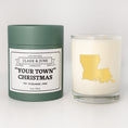 Load image into Gallery viewer, Double wicked soy candle in a 13.5 oz tumbler with the state of   Louisianaprinted in 22k gold foil on the face. Green cylinder packaging with "Your Town" Christmas on the label. SEO Text – Drinking glass, soy wax candle, Christmas Candle, hand poured, small batch, scented candle, Woman Owned, local candle, Housewarming present, gives back, charity, community candle, becomes a cocktail glass, closing gift.