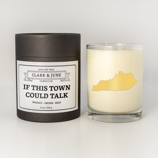 Double wicked soy candle in a 13.5 oz tumbler with the state of Kentucky printed in 22k gold foil on the face. Black cylinder packaging with “If This Town Could Talk” on the label. SEO Text – Drinking glass, soy wax candle, Kentucky candle, hand poured, small batch, scented candle, Woman Owned, local candle, Housewarming present, gives back, charity, community candle, becomes a cocktail glass, closing gift. 