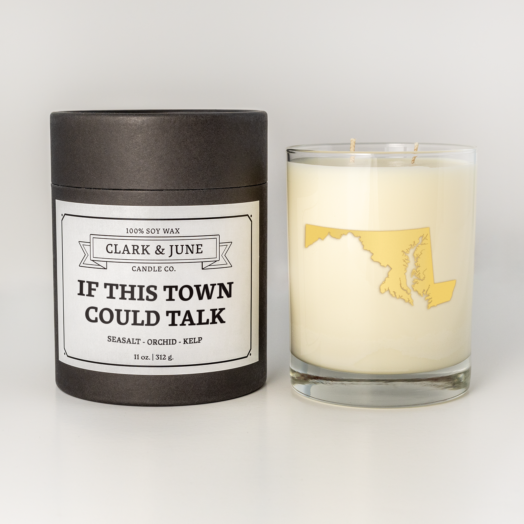 Double wicked soy candle in a 13.5 oz tumbler with the state of Maryland printed in 22k gold foil on the face. Black cylinder packaging with “If this town could talk” on the label. 