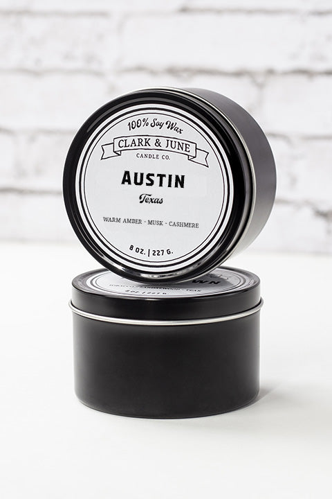 Single wicked 8oz candle in a black finish with “Austin Texas” on the label. SEO Text –soy wax candle, Alabama candle, hand poured, small batch, scented candle, Woman Owned, local candle, Housewarming present, gives back, charity, community candle, closing gift. 