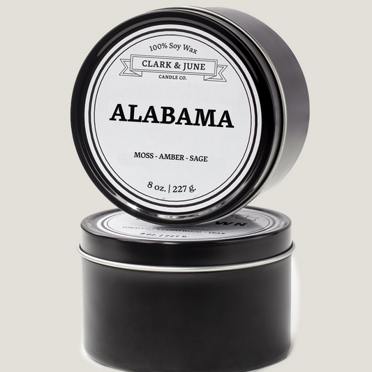 Single wicked 8oz candle in a black finish with “Alabama” on the label. SEO Text –soy wax candle, Alabama candle, hand poured, small batch, scented candle, Woman Owned, local candle, Housewarming present, gives back, charity, community candle, closing gift. 