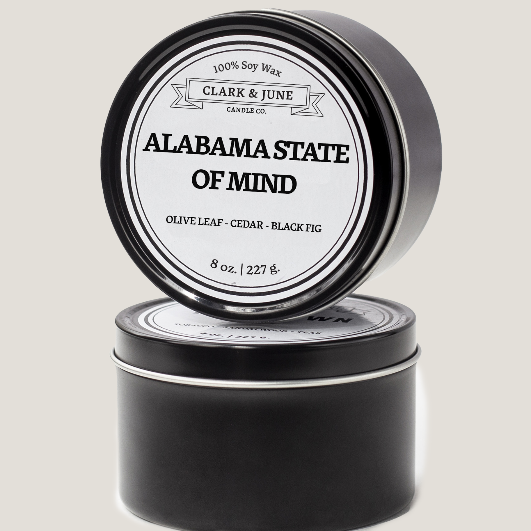 Single wicked 8oz candle in a black finish with Alabama State of Mind on the label. SEO Text –soy wax candle, Alabama candle, hand poured, small batch, scented candle, Woman Owned, local candle, Housewarming present, gives back, charity, community candle, closing gift. 
