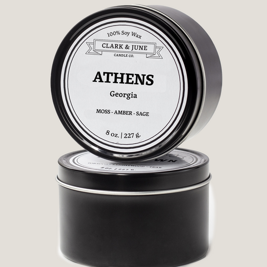 Single wicked 8oz candle in a black finish with “Athens, Georgia” on the label. SEO Text –soy wax candle, Alabama candle, hand poured, small batch, scented candle, Woman Owned, local candle, Housewarming present, gives back, charity, community candle, closing gift. 