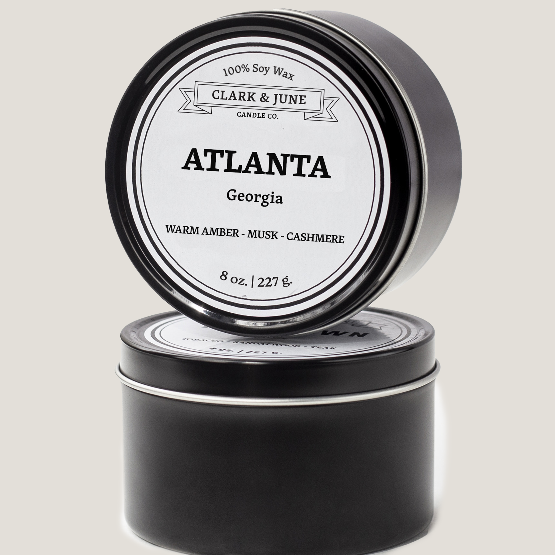 Single wicked 8oz candle in a black finish with Atlanta  on the label. SEO Text –soy wax candle, Georgia candle, hand poured, small batch, scented candle, Woman Owned, local candle, Housewarming present, gives back, charity, community candle, closing gift. 
