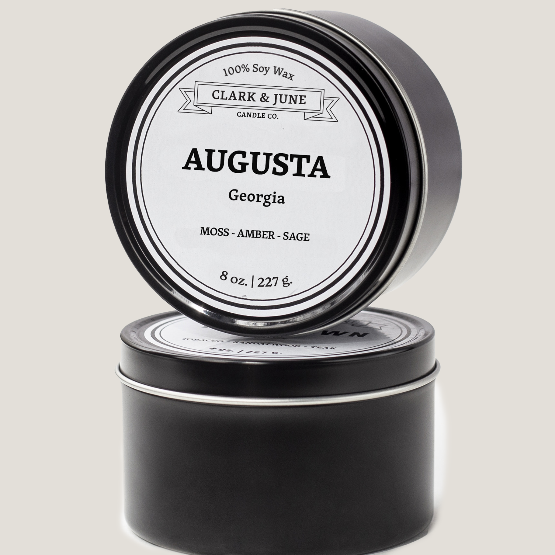 Single wicked 8oz candle in a black finish with Augusta  on the label. SEO Text –soy wax candle, Georgia candle, hand poured, small batch, scented candle, Woman Owned, local candle, Housewarming present, gives back, charity, community candle, closing gift. 
