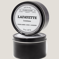 Load image into Gallery viewer, Single wicked 8oz candle in a black finish with Lafayette  on the label. SEO Text –soy wax candle, Louisiana candle, hand poured, small batch, scented candle, Woman Owned, local candle, Housewarming present, gives back, charity, community candle, closing gift. 

