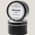 Load image into Gallery viewer, Single wicked 8oz candle in a black finish with Mclean  on the label. SEO Text –soy wax candle, Virginia candle, hand poured, small batch, scented candle, Woman Owned, local candle, Housewarming present, gives back, charity, community candle, closing gift. 

