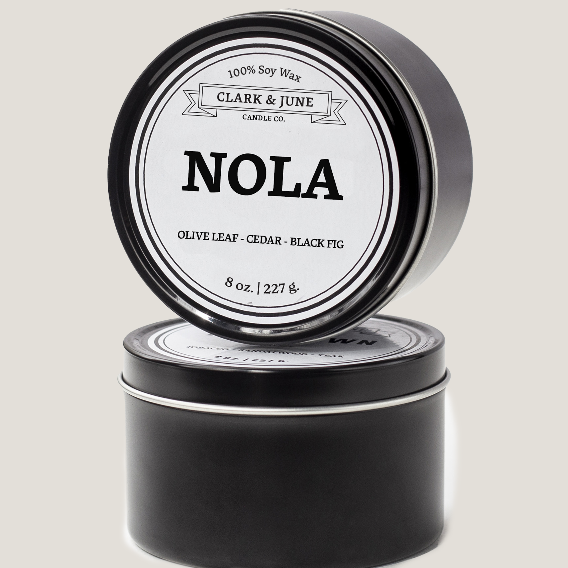 Single wicked 8oz candle in a black finish with NOLA  on the label. SEO Text –soy wax candle, Louisiana candle, hand poured, small batch, scented candle, Woman Owned, local candle, Housewarming present, gives back, charity, community candle, closing gift. 
