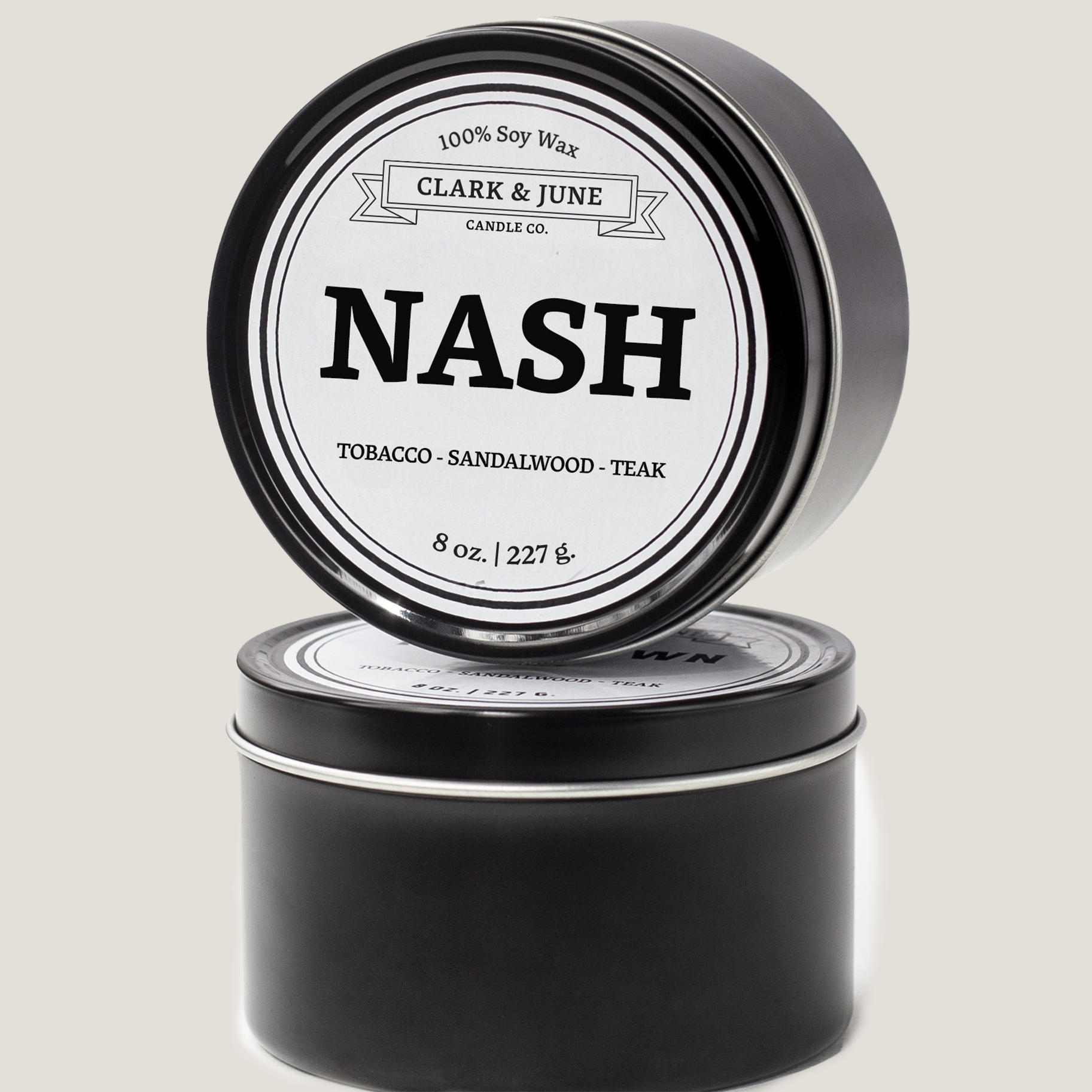 Single wicked 8oz candle in a black finish with NASH on the label. SEO Text –soy wax candle, Tennessee candle, hand poured, small batch, scented candle, Woman Owned, local candle, Housewarming present, gives back, charity, community candle, closing gift. 
