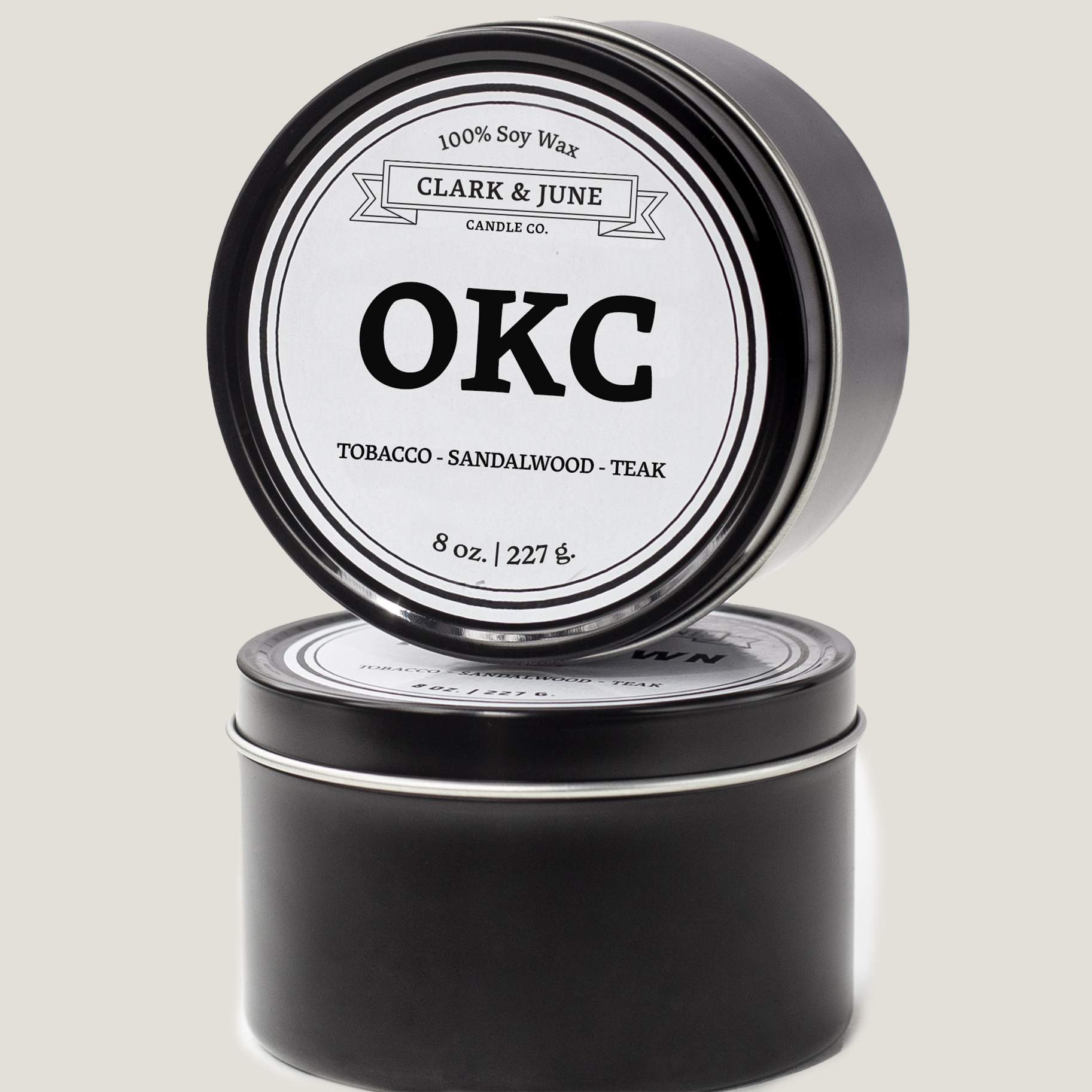 Single wicked 8oz candle in a black finish with OKC on the label. SEO Text –soy wax candle, Oklahoma candle, hand poured, small batch, scented candle, Woman Owned, local candle, Housewarming present, gives back, charity, community candle, closing gift. 
