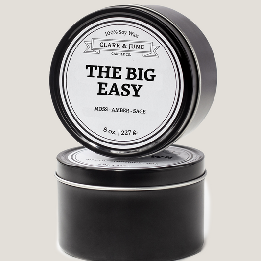 Single wicked 8oz candle in a black finish with The Big Easy  on the label. SEO Text –soy wax candle, Louisiana candle, hand poured, small batch, scented candle, Woman Owned, local candle, Housewarming present, gives back, charity, community candle, closing gift. 
