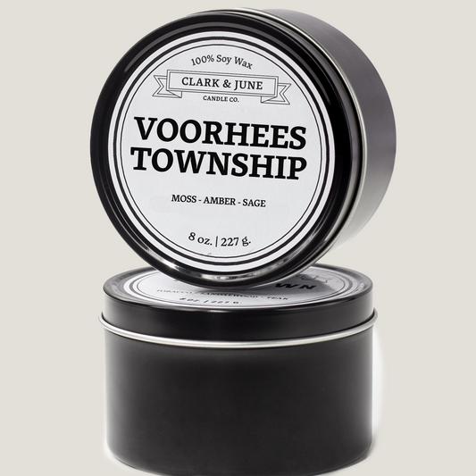 Single wicked 8oz candle in a black finish with Voorhees Township on the label. SEO Text –soy wax candle, New Jersey candle, hand poured, small batch, scented candle, Woman Owned, local candle, Housewarming present, gives back, charity, community candle, closing gift. 
