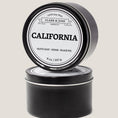 Load image into Gallery viewer, Single wicked 8oz candle in a black finish with “North Carolina” on the label. SEO Text –soy wax candle, Alabama candle, hand poured, small batch, scented candle, Woman Owned, local candle, Housewarming present, gives back, charity, community candle, closing gift. 
