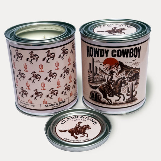14oz Cowboy design soy wax candle in a pint sized paint can made by Clark & June Candle Co. The candle is wrapped with a brown and tan label showing cowboys on bucking horses and cacti on the back with a wood cut design of a Cowboy riding on a horse by a cabin with the phrase “Howdy Cowboy” on the front. The scent is Moss – Amber - Sage and was hand poured in small batches. 

Cowboy Candle, Scented Candle, Paint Can Candle. Single Cotton Wick
