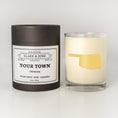 Load image into Gallery viewer, Double wicked soy candle in a 13.5 oz tumbler with the state of Oklahoma printed in 22k gold foil on the face. Black cylinder packaging with a customizable label. SEO Text – Drinking glass, soy wax candle, Florida candle, hand poured, small batch, scented candle, Woman Owned, local candle, Housewarming present, gives back, charity, community candle, becomes a cocktail glass, closing gift. 
