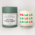 Load image into Gallery viewer, Double wicked soy candle in a 13.5 oz tumbler with the state of Fa La La printed on the face. Green cylinder packaging with Fa La La "Your Town"on the label. SEO Text – Drinking glass, soy wax candle, Christmas Candle, hand poured, small batch, scented candle, Woman Owned, local candle, Housewarming present, gives back, charity, community candle, becomes a cocktail glass, closing gift. 
