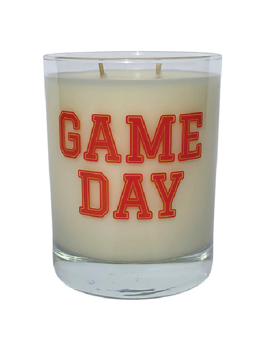 Double wicked soy candle in a 13.5 oz tumbler with the Game Day printed on the face of the vessel in Orange. SEO Text – Drinking glass, soy wax candle, Football, Tailgate, hand poured, small batch, scented candle, Woman Owned, local candle, Housewarming present, gives back, charity, community candle, becomes a cocktail glass, closing gift. 