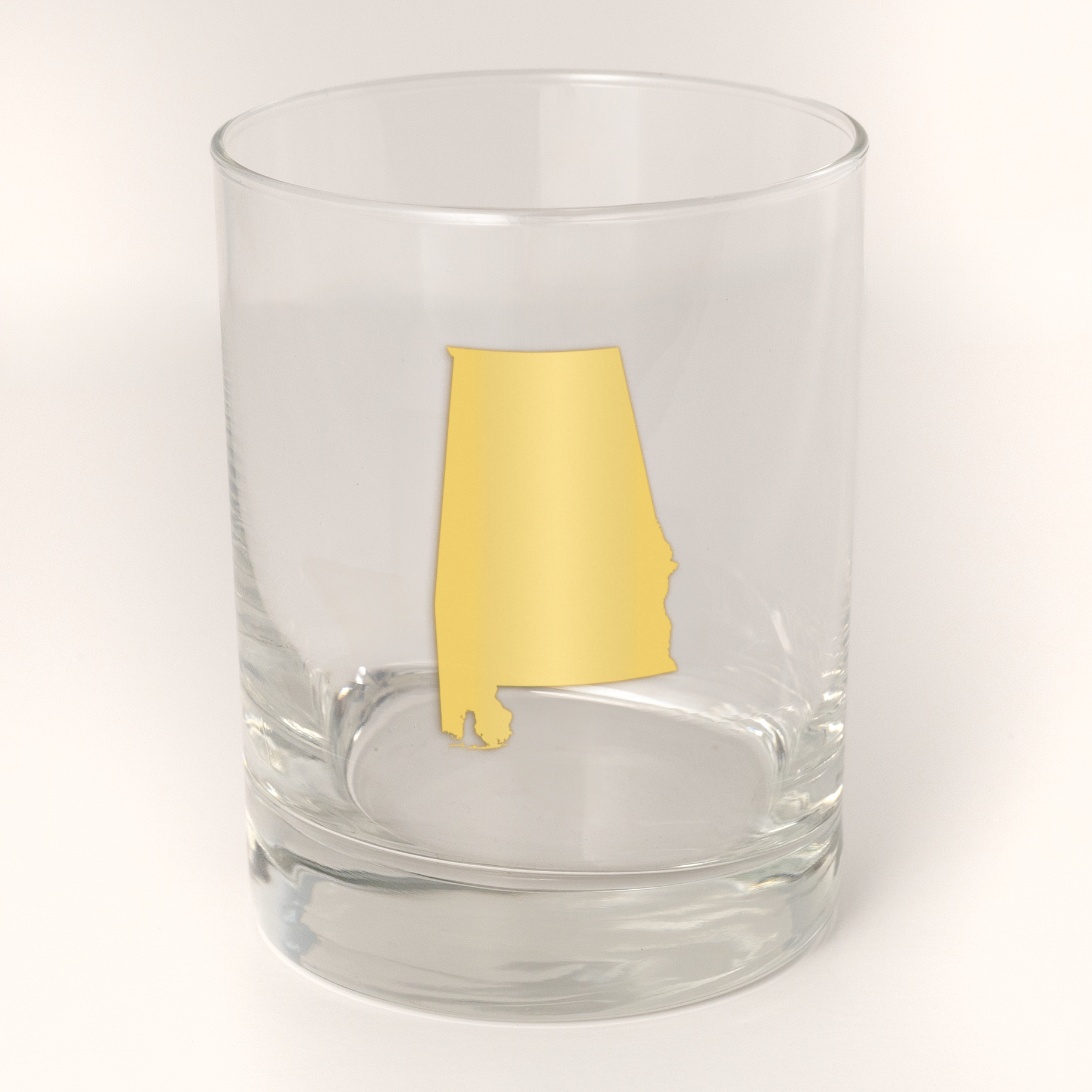 13.5oz Old Fashioned Rocks Glass with the state of Alabama silhouetted in 22k gold foil on the face.  Drinking Glass