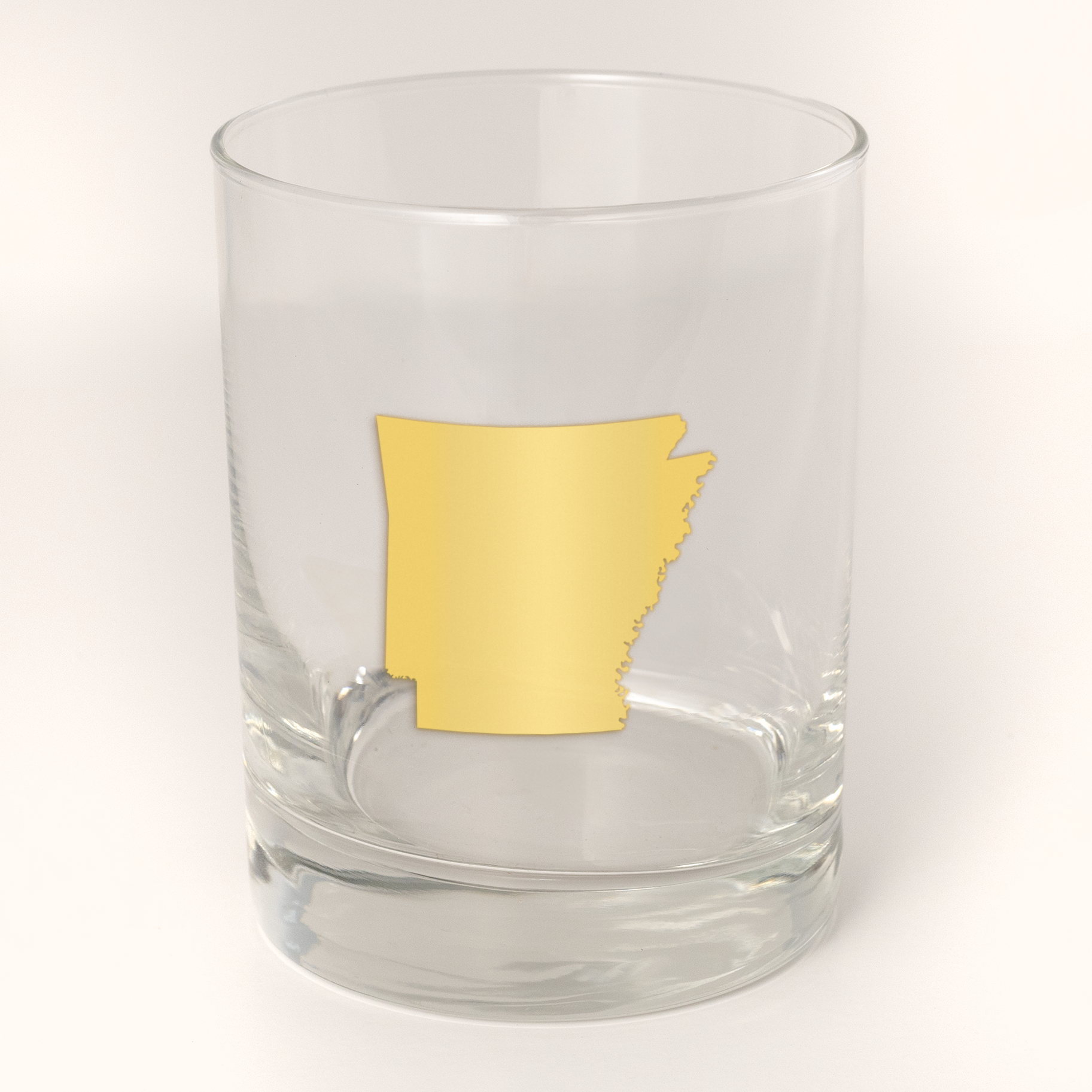 13.5oz Old Fashioned Rocks Glass with the state of Arkansas silhouetted in 22k gold foil on the face. Drinking Glass