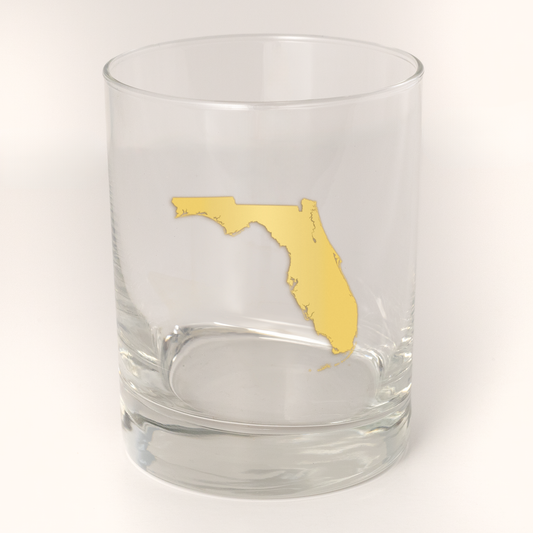 13.5oz Old Fashioned Rocks Glass with the state of Florida silhouetted in 22k gold foil on the face.  Drinking Glass