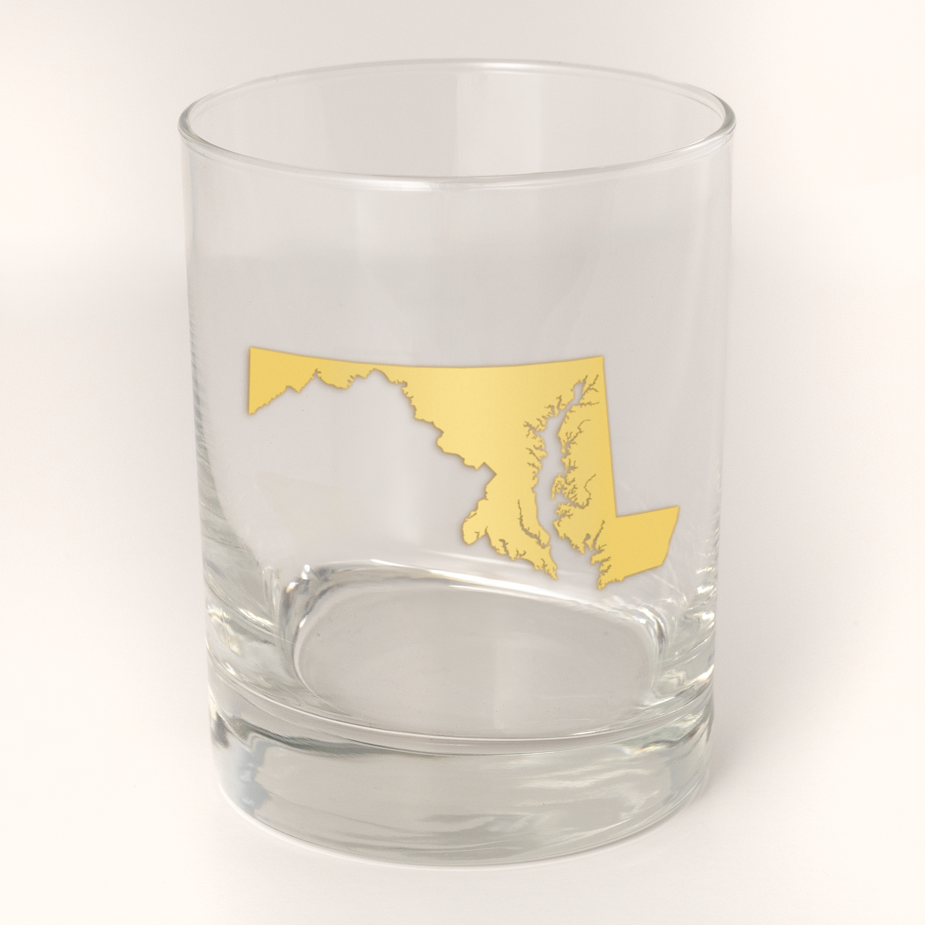 13.5oz Old Fashioned Rocks Glass with the state of Maryland silhouetted in 22k gold foil on the face.  Drinking Glass