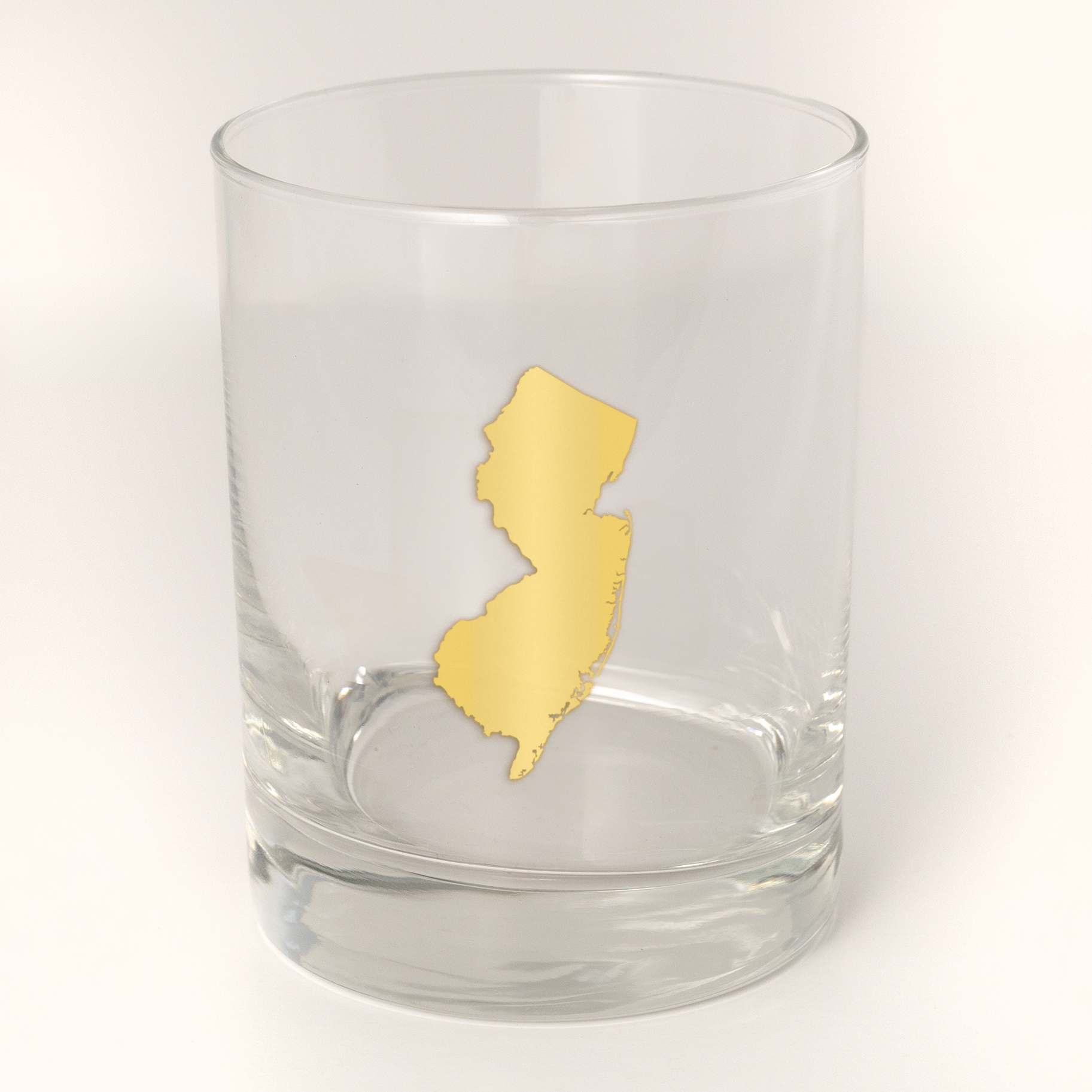 13.5oz Old Fashioned Rocks Glass with the state of New Jersey silhouetted in 22k gold foil on the face.  Drinking Glass