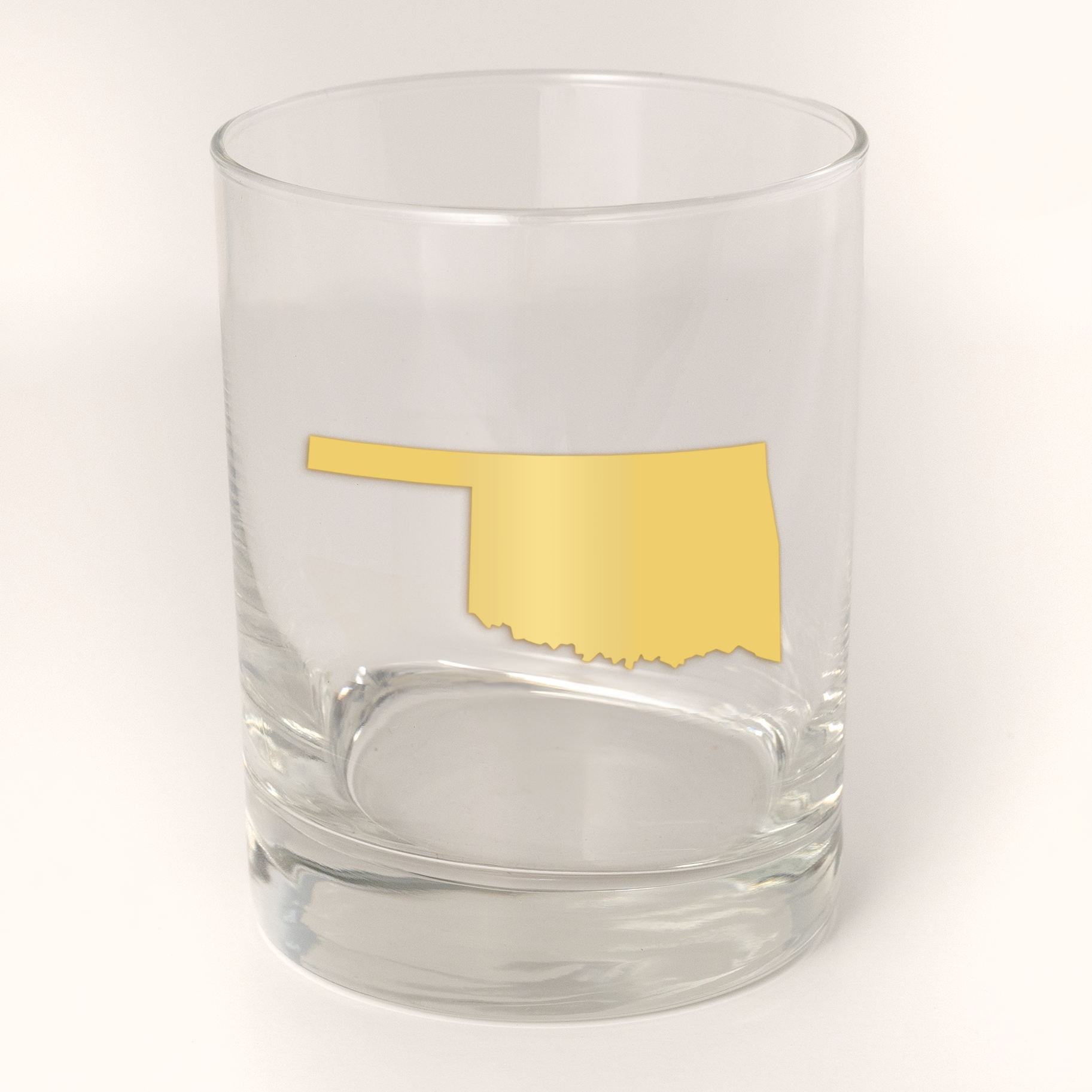 13.5oz Old Fashioned Rocks Glass with the state of Oklahoma silhouetted in 22k gold foil on the face.  Drinking Glass