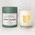 Load image into Gallery viewer, Double wicked soy candle in a 13.5 oz tumbler with the state of   Arkansas printed in 22k gold foil on the face. Green cylinder packaging with Happy Holidays in "Your Town" on the label. SEO Text â€“ Drinking glass, soy wax candle, Christmas Candle, hand poured, small batch, scented candle, Woman Owned, local candle, Housewarming present, gives back, charity, community candle, becomes a cocktail glass, closing gift. 

