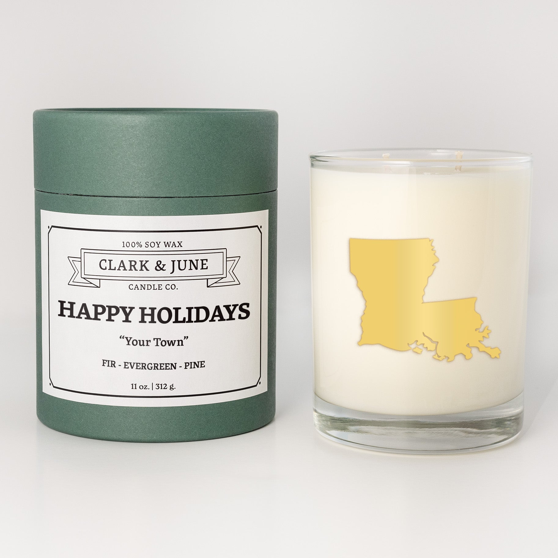 Double wicked soy candle in a 13.5 oz tumbler with the state of   Louisiana printed in 22k gold foil on the face. Green cylinder packaging with Happy Holidays in "Your Town" on the label. SEO Text â€“ Drinking glass, soy wax candle, Christmas Candle, hand poured, small batch, scented candle, Woman Owned, local candle, Housewarming present, gives back, charity, community candle, becomes a cocktail glass, closing gift. 
