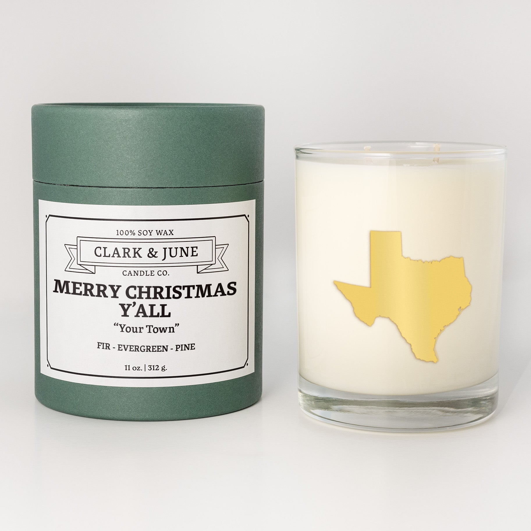 Double wicked soy candle in a 13.5 oz tumbler with the state of Texasprinted in 22k gold foil on the face. Green cylinder packaging with Merry Christmas Y'All "Your Town"on the label. SEO Text – Drinking glass, soy wax candle, Christmas Candle, hand poured, small batch, scented candle, Woman Owned, local candle, Housewarming present, gives back, charity, community candle, becomes a cocktail glass, closing gift. 