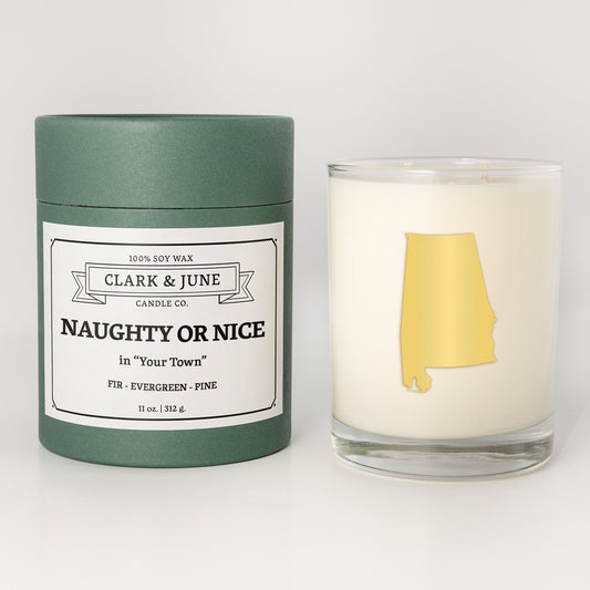 Double wicked soy candle in a 13.5 oz tumbler with the state of   Alabama printed in 22k gold foil on the face. Green cylinder packaging with Naughty or Nice in "Your Town" on the label. SEO Text â€“ Drinking glass, soy wax candle, Christmas Candle, hand poured, small batch, scented candle, Woman Owned, local candle, Housewarming present, gives back, charity, community candle, becomes a cocktail glass, closing gift. 
