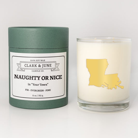 Double wicked soy candle in a 13.5 oz tumbler with the state of Louisianaprinted in 22k gold foil on the face. Green cylinder packaging with Naughty or Nice in "Your Town" on the label. SEO Text – Drinking glass, soy wax candle, Christmas Candle, hand poured, small batch, scented candle, Woman Owned, local candle, Housewarming present, gives back, charity, community candle, becomes a cocktail glass, closing gift. 